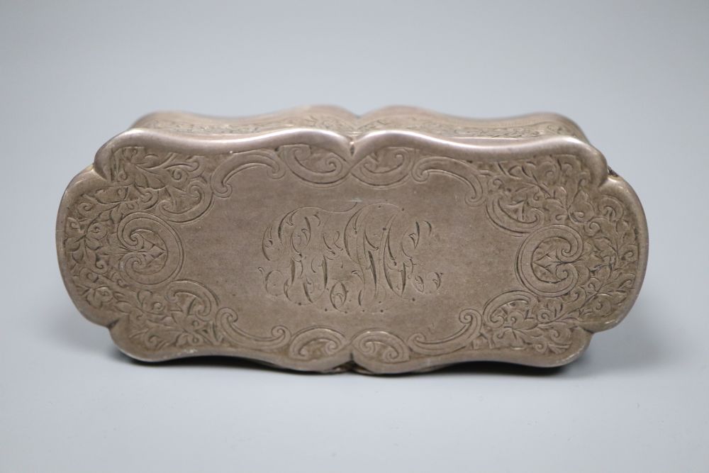 A late Victorian engraved silver shaped oval snuff box, Colen Hewer Cheshire, Birmingham, 1893, 82mm, 89.4 grams.